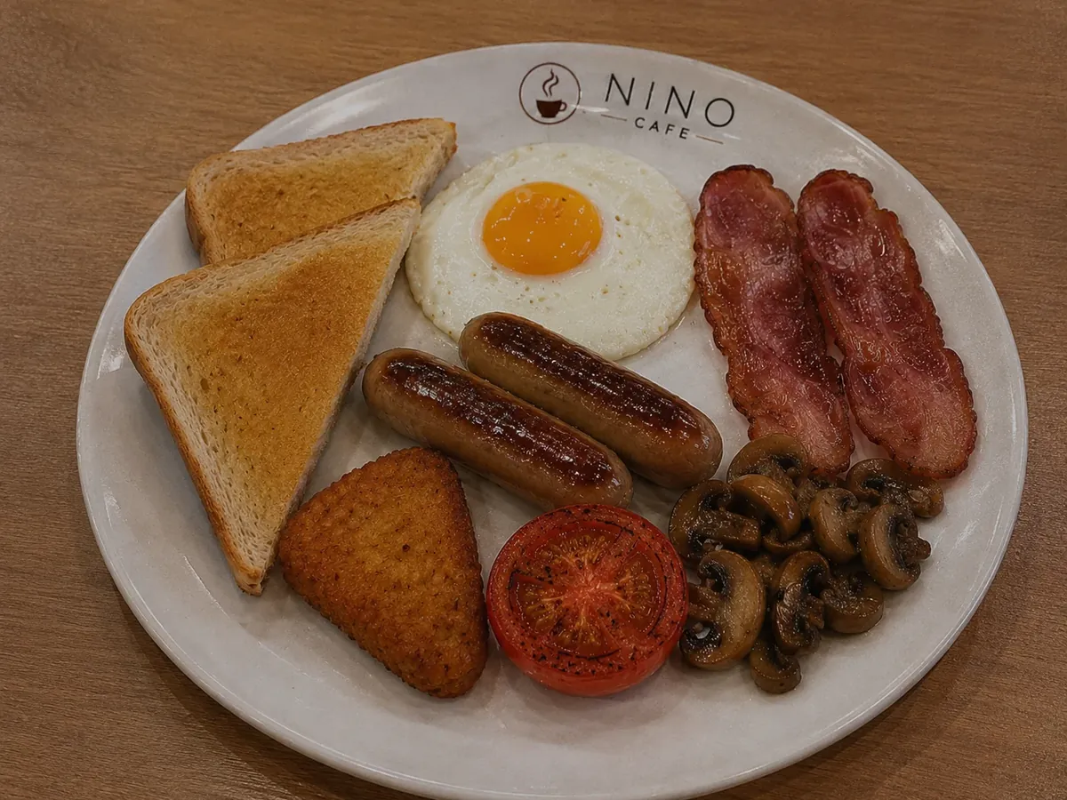 The English breakfast — egg, turkey bacon, beef sausages, hash brown, grilled tomato, mushrooms and toast